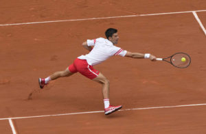 Serbia’s Novak Djokovic plays a return to Italy’s Lorenzo Musetti during their fourth-round match on Day 9 of the French Open at Roland Garros in Paris, France, on Monday.
                                 AP photo