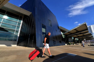 A passenger leaves the Wilkes-Barre/Scranton International Airport terminal in this file photo.Pending Luzerne County Council approval, the county District Attorney’s Office will provide law enforcement coverage at security checkpoints required for all of the airport’s departing flights.
                                 Times Leader file photo