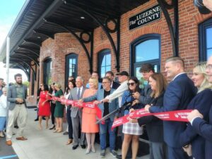Community and government leaders lined up Thursday for a formal ribbon-cutting at Luzerne County’s tourism office in the historic former train station in downtown Wilkes-Barre.
                                 Jennifer Learn-Andes | Times Leader