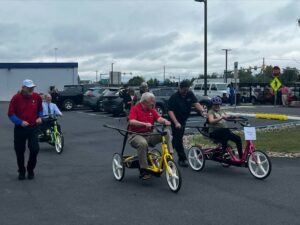Former Pennsylvania Gov. Tom Corbett and John Cosgrove, CEO of AllOne Foundation, try to keep up with Faith Garrido of Monroe County.
                                 Submitted Photo