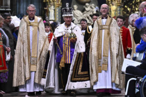 Britain’s King Charles III wearing the Imperial state Crown and carrying the Sovereign’s Orb and Sceptre leaves Westminster Abbey after coronation in central London Saturday, May 6, 2023. The set-piece coronation is the first in Britain in 70 years, and only the second in history to be televised. Charles will be the 40th reigning monarch to be crowned at the central London church since King William I in 1066.
                                 Ben Stansall | POOL photo via AP
