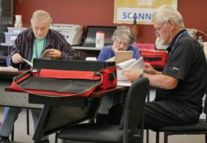Luzerne County Election Board members (from left) Daniel Schramm, Audrey Serniak and James Mangan recount ballots during a May 16 primary election reconciliation review Monday at the county’s Penn Place building in downtown Wilkes-Barre.
                                 Jennifer Learn-Andes|Times Leader