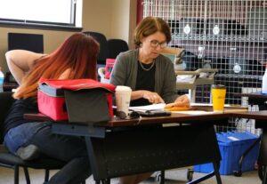 Luzerne County Election Board members Alyssa Fusaro, at left, and Denise Williams review election paperwork following the May primary election. Williams, the board chairwoman, said the board is awaiting assignment of outside legal counsel in light of the county’s legal filings against the board over a ballot referendum.
                                 Times Leader file photo