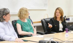 Susan Magnotta, at right, president of Junior Achievement of Northeastern Pennsylvania, details career preparation programs for students that will be partially funded with Luzerne County’s federal American Rescue Plan Act allocation. Seated, from left, during the Wednesday session are county Manager Romilda Crocamo and county grant writer Michele Sparich.
                                 Jennifer Learn-Andes | Times Leader