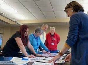 Luzerne County Election Board members review ballots Tuesday during the third day of the general election adjudication process. Clockwise, from left, are: Alyssa Fusaro, Audrey Serniak, Daniel Schramm, James Mangan and Denise Williams.