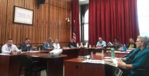 Luzerne County Council members review a report during Tuesday’s meeting.
                                 Jennifer Learn-Andes | Times Leader