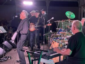 Eddie Day Pashinski and his TNT band belt out a song at Saturday’s annual Summer Reunion Dance at Irem Temple in Dallas. Bass player Bob Gryziec looks on.
                                 Bill O’Boyle | Times Leader
