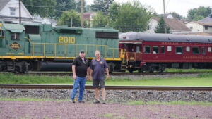 Standing at Reading Blue Mountain & Northern Railroad Co.’s Pittston station in August, company Chairman/CEO Andy M. Muller Jr, at right, and Matt Fisher, senior vice president and general manager of the company’s passenger department, discussed the company’s interest in purchasing Luzerne County’s rail line.
                                 File photo