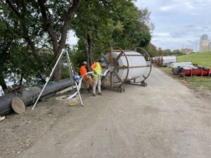 Contractors install steel-reinforced PVC that interlocks as is fed through manholes into a Wyoming Valley Sanitary Authority interceptor line in Wilkes-Barre, creating a new standalone pipe within the existing line.
                                 Courtesy of Wyoming Valley Sanitary Authority