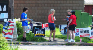A voter stops to chat with poll workers Tuesday at the Kingston Recreation Center.
                                 Mark Moran | For Times Leader